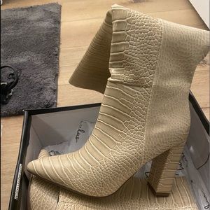 Knee high heeled boots